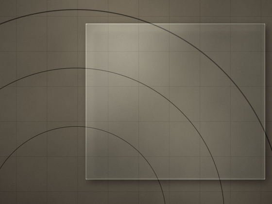 A sheet of glass laid over a setting-out sheet, arcs and grid lines running underneath it.
