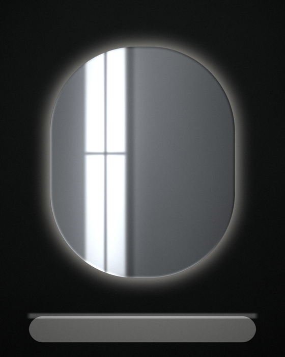 A soft-cornered mirror above a basin, a halo of warm light escaping from behind its edges onto a dark wall.