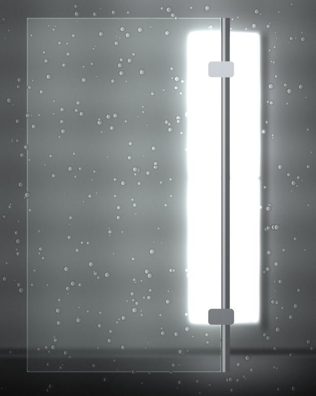A frameless shower screen beaded with water, its polished vertical edge and chrome hinges lit from the side.